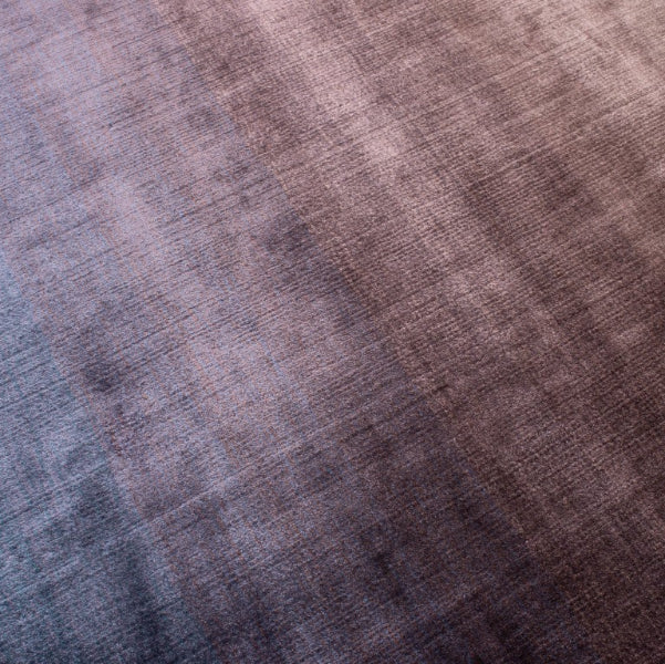 Close-up of a fabric with a gradient of brown and blue colors.