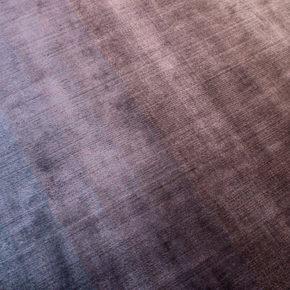 Close-up of a fabric with a gradient of brown and blue colors.