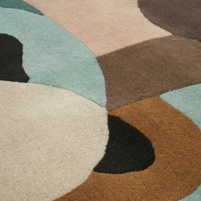 Close-up of a multicolored abstract rug with circular patterns.