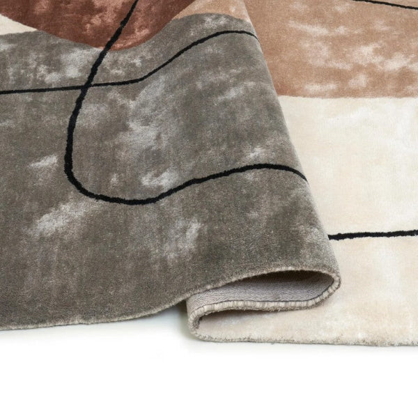 Luxury rug by Carpet Décor with abstract patterns in earthy tones and soft texture