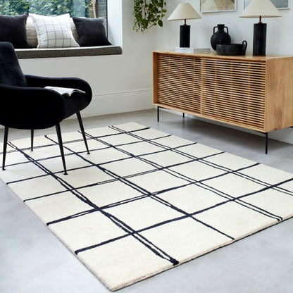 Asiatic Albany geometric rug UK in white with black grid lines in modern living room