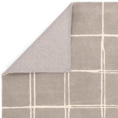 Asiatic luxury Albany geometric rug UK in beige with white grid pattern and folded corner showing texture