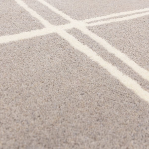 Close-up of Asiatic Albany geometric rug UK featuring luxury soft textured pile with intersecting white lines