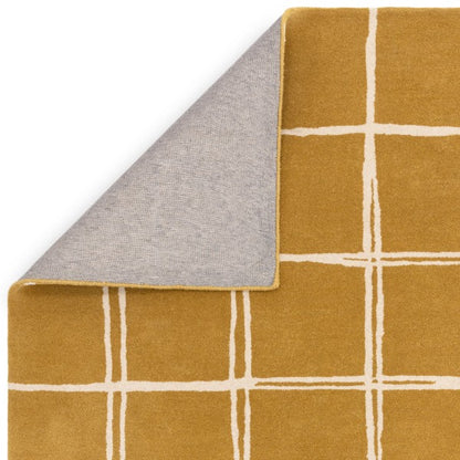Luxury Asiatic Albany geometric rug UK in mustard yellow with cream grid pattern and corner folded