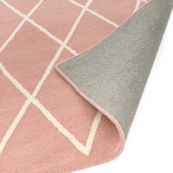 Asiatic luxury Albany geometric rug UK in pink with white lines and grey backing corner folded