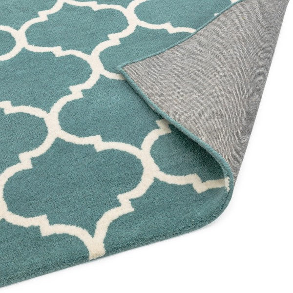 Asiatic luxury Albany geometric rug UK in teal with white pattern and corner folded to show backing