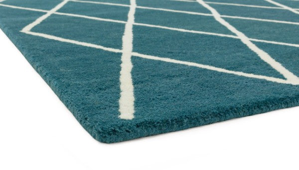 Asiatic luxury Albany geometric rug UK in teal with white angled line pattern, close-up on corner edge
