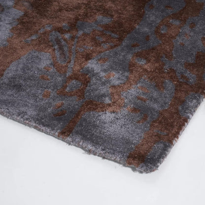 Close-up of a brown and gray textured rug on a white background