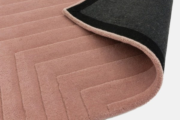 Asiatic Contemporary Plains Rug in luxurious soft pink with subtle geometric texture and black backing
