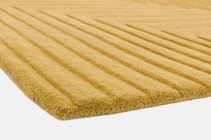 Close-up of a beige Asiatic Contemporary Plains Rug showing textured ribbed pattern and thick pile