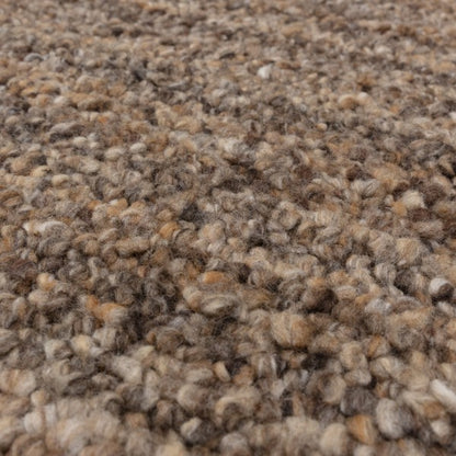 Close-up of Asiatic Boho Abbus Rug with thick textured wool fibres in earthy brown tones