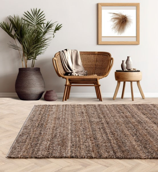 Asiatic Boho Abbus Rug luxury textured brown rug in a cosy modern living room setting