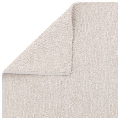 Asiatic luxury Boho Abbus Rug in soft cream with a textured plush pile and folded corner