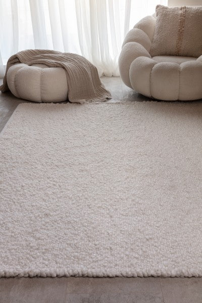 Asiatic Boho Abbus Rug luxury soft textured rug in neutral cream colour in a modern living room