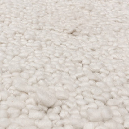 Close-up of Asiatic Boho Abbus Rug showcasing its soft, textured cream wool fibres in luxury design
