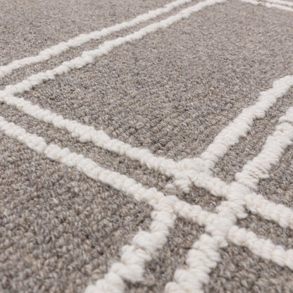 Close-up of luxury Asiatic Boho Collection Ada Rug showing textured grey fibres with white geometric patterns