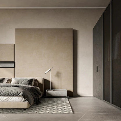 Modern bedroom with neutral tones, bed, lamp, and wardrobe.