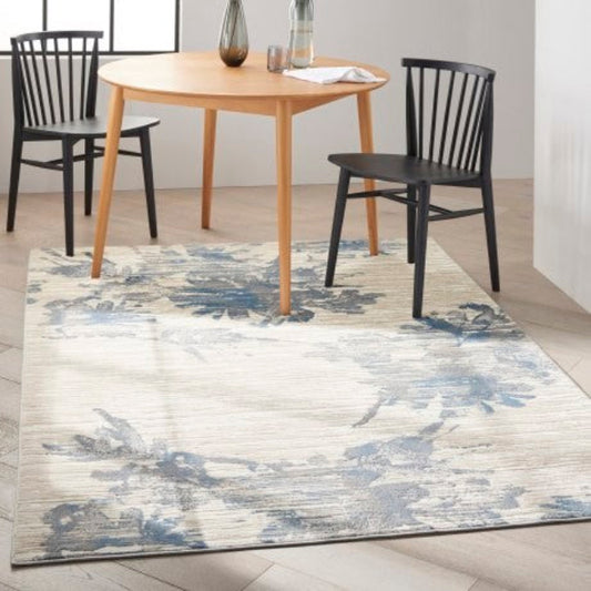 Calvin Klein Enchanting Rug Collection in soft hues, enhancing modern dining spaces with floral patterns