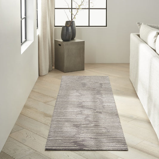 Calvin Klein Linear Rug Collection in Grey, featuring a minimalist striped design for modern interiors