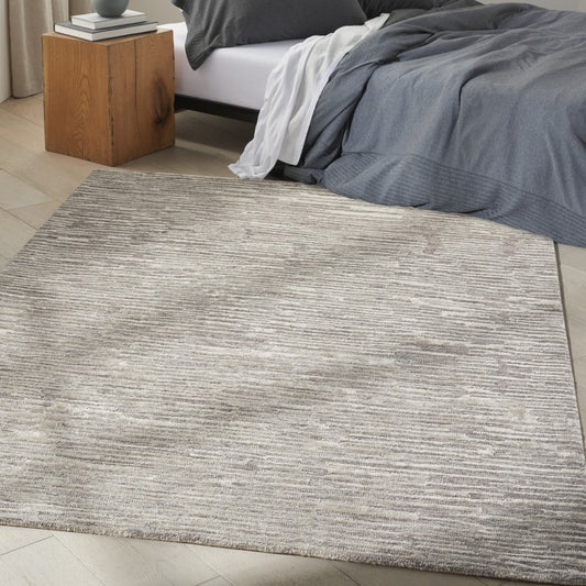 Calvin Klein Linear Rug Collection in neutral tones, ideal for contemporary bedroom decor with a soft texture