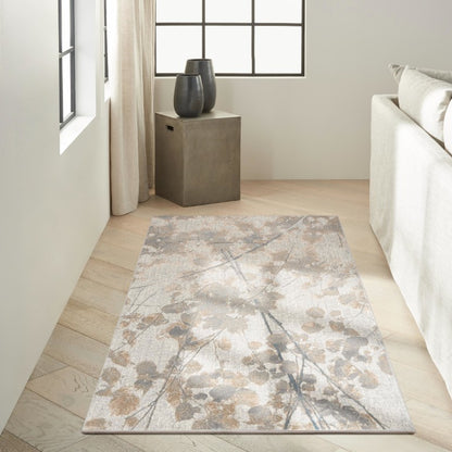 Elegant Nourison Luxury Rug from The Calvin Klein Rush Rug Collection with a floral design in neutral tones