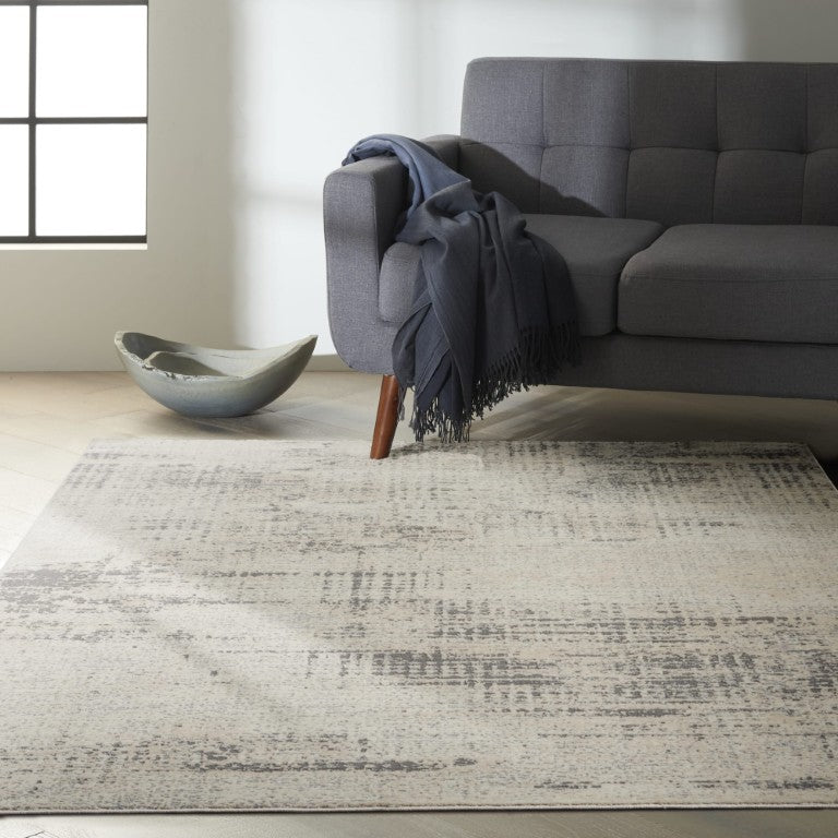 The Calvin Klein Rush Rug Collection in soft grey tones, enhancing modern living space with elegance