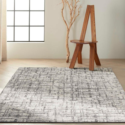 Nourison The Calvin Klein Rush Rug Collection in grey with modern abstract design, perfect for stylish interiors