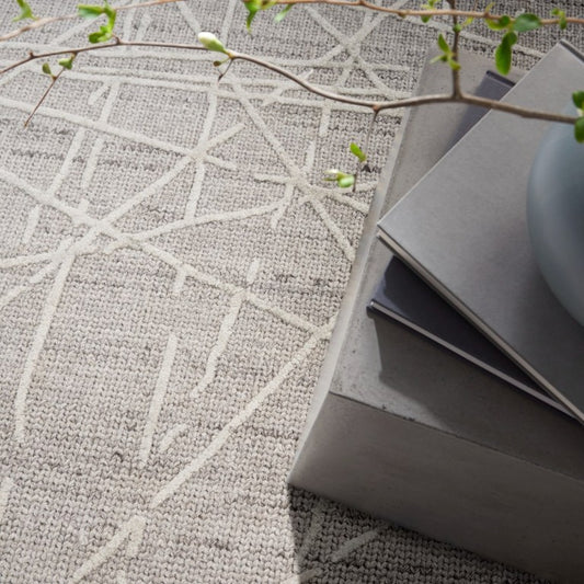 Calvin Klein Wander Rug Collection featuring a stylish geometric pattern in neutral tones