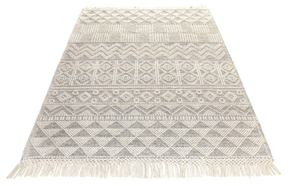 Concept Looms Anya Rug luxury rug with intricate geometric patterns and fringed edges in neutral tones