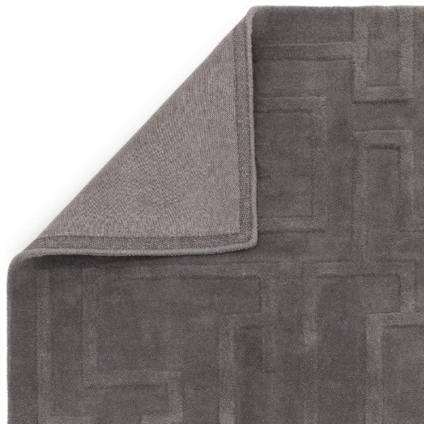 Luxury grey Contemporary Plains Collection Maze Rug by Asiatic with textured maze pattern and folded corner
