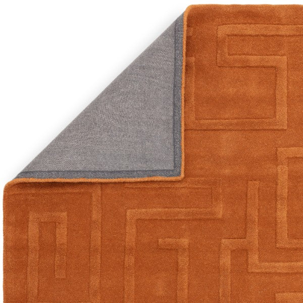 Asiatic Contemporary Plains Collection Maze Rug in burnt orange with textured maze pattern and corner flipped