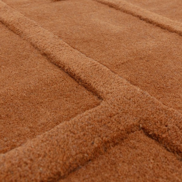 Close-up of Asiatic Contemporary Plains Collection Maze Rug showing soft textured brown geometric pattern