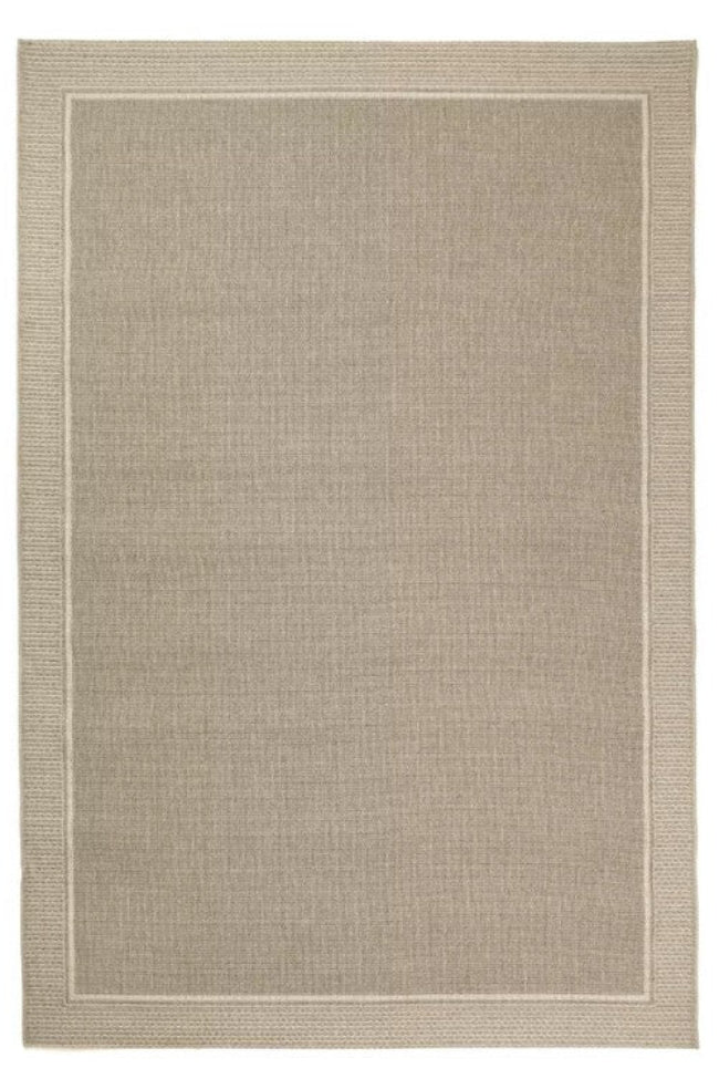 Beige area rug with a subtle pattern on a white background