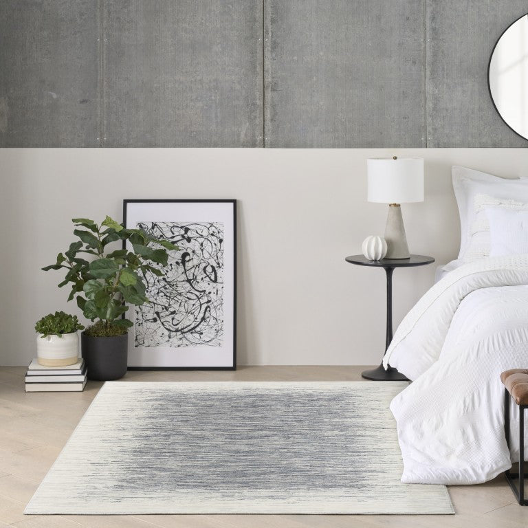The DKNY Grand Street Rug Collection in a stylish room setting with modern decor and a soothing colour palette