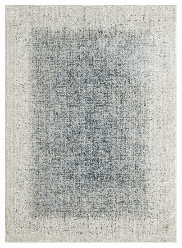 The DKNY Grand Street Rug Collection featuring a subtle blue and cream abstract design