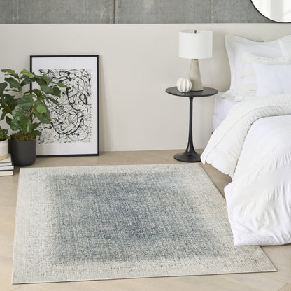 Stylish luxury rug from The DKNY Grand Street Rug Collection, featuring a modern design in soothing blue tones