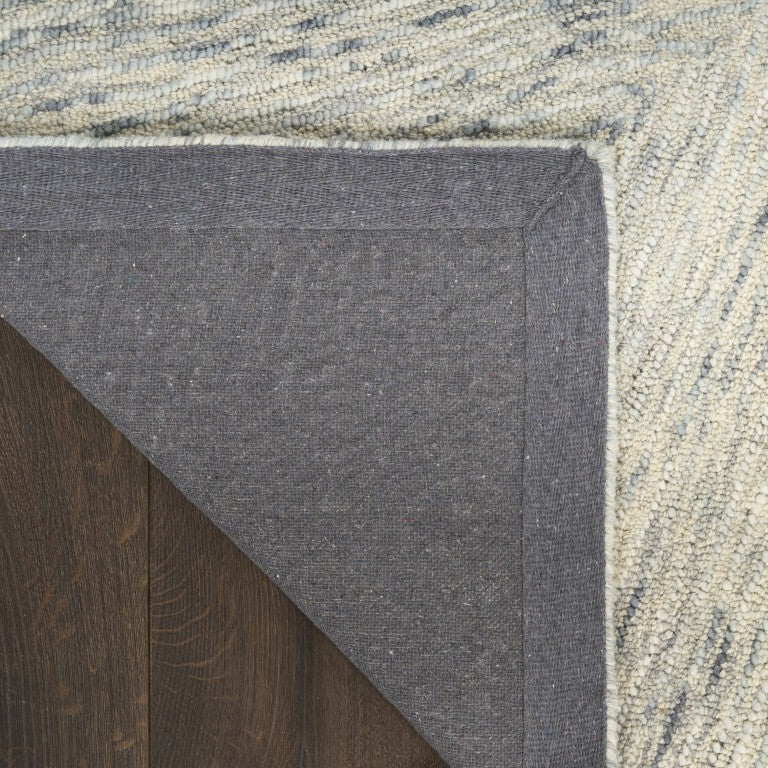 Detail of The DKNY Pure Angles Rug Collection showcasing a textured weave and stylish edge design
