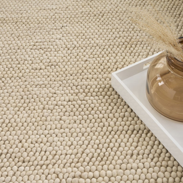 Nourison DKNY Pure Knots Rug Collection in a neutral colour with a textured woven design