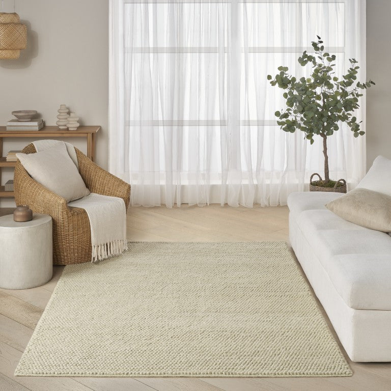 Nourison The DKNY Pure Knots Rug Collection in a soft beige, enhancing a stylish living room decor