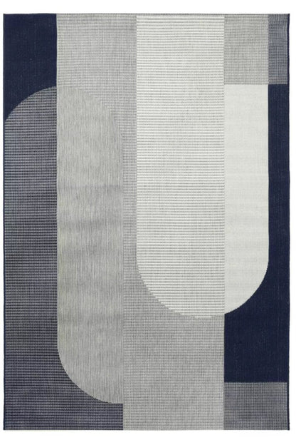 Geometric patterned rug with abstract shapes on a dark blue background