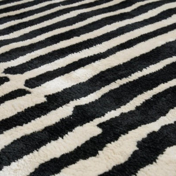 Close-up of a black and white striped patterned rug
