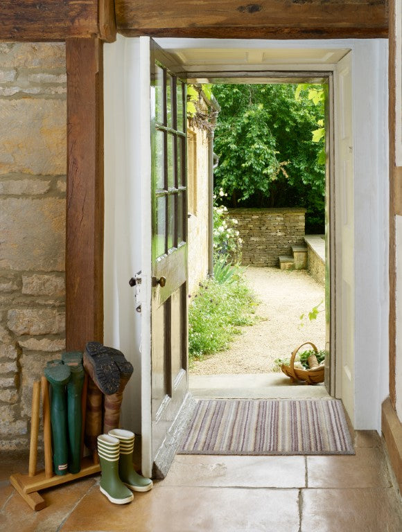 Turtle Mat striped floor mat at the entrance, enhancing home decor and trapping dirt from shoes