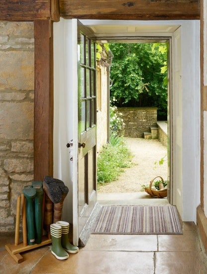 Turtle Mat striped floor mat at the entrance, enhancing home decor and trapping dirt from shoes