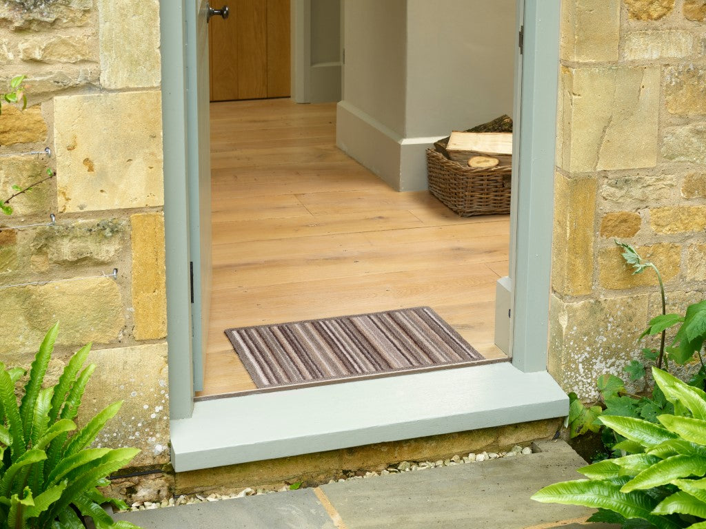 Turtle Mat Striped Floor Mat at the entrance, perfect for keeping floors clean and stylish