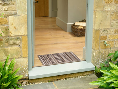 Turtle Mat Striped Floor Mat at the entrance, perfect for keeping floors clean and stylish