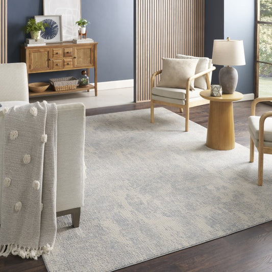 Nourison Exhale Abstract Rug in a stylish living room with elegant decor and neutral tones