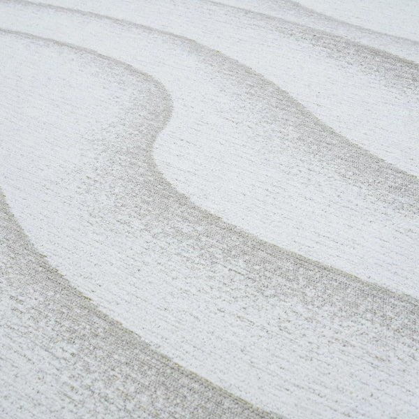 Close-up of a textured surface with wavy patterns in gray and white.