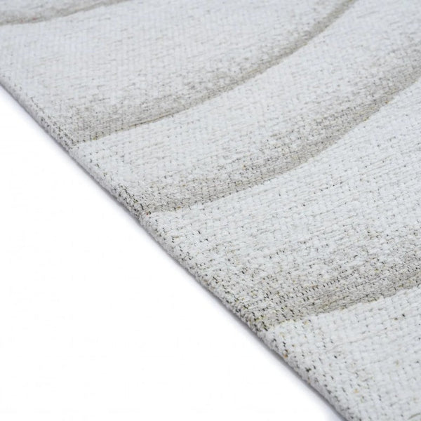 Close-up of a textured rug with wavy pattern on a white background