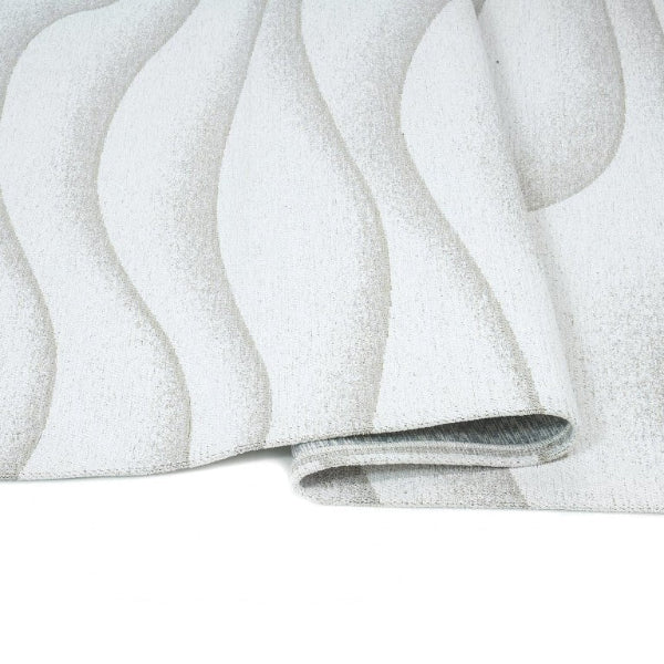 Close-up of a textured white surface with wavy patterns