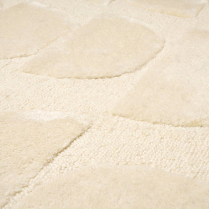 Close-up of a textured beige rug surface